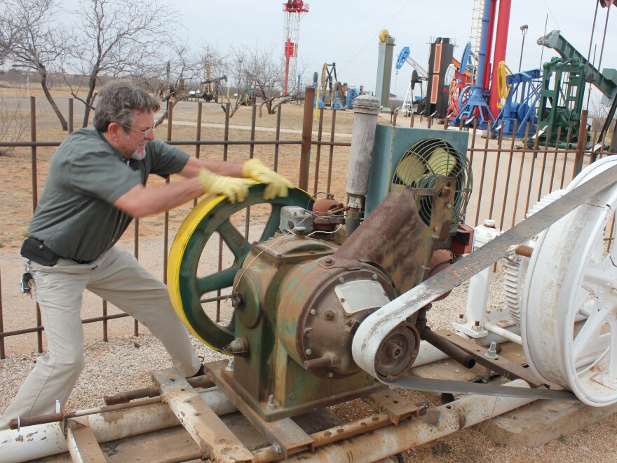 At the Permian Basin Petroleum Museum, facilities manager James White demonstrates how a 'Johnny Popper' engine used to power oil pumpjacks.