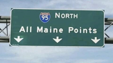 Highway sign for 95 North  saying "All Maine Points" with arrows pointing