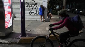 Montserrat Fuentes stands on Calzada de Tlalpan where she has worked as a sex worker for 20 years and the city is building a new bike lane ahead of the World Cup soccer tournament, blocking cars from pulling over and closing the metro at night, in Mexico City, Friday, Jan. 30, 2026. (AP Photo/Eduardo Verdugo)