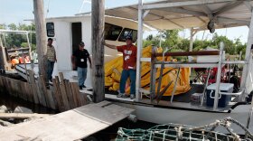 Upon hearing that the gulf gusher had been stopped, oysterman Johnny Schneider (right) of St. Bernard Parish, La., said: "Eh, the damage is done. The oil's everywhere now. You ain't never gonna get it out of the water."