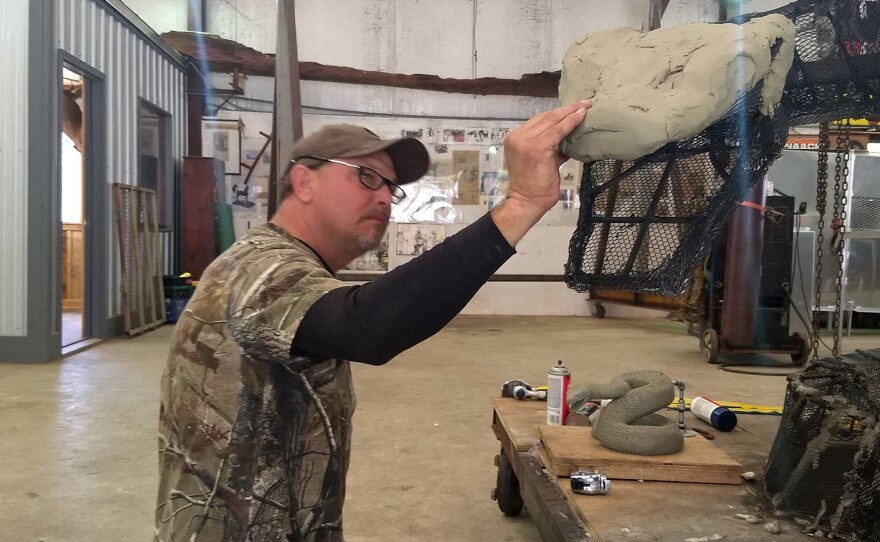 Pictures of the sculpting process taken to create the Rattler bronze.