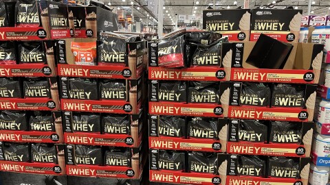 A palette of whey protein powder on sale at a Costco