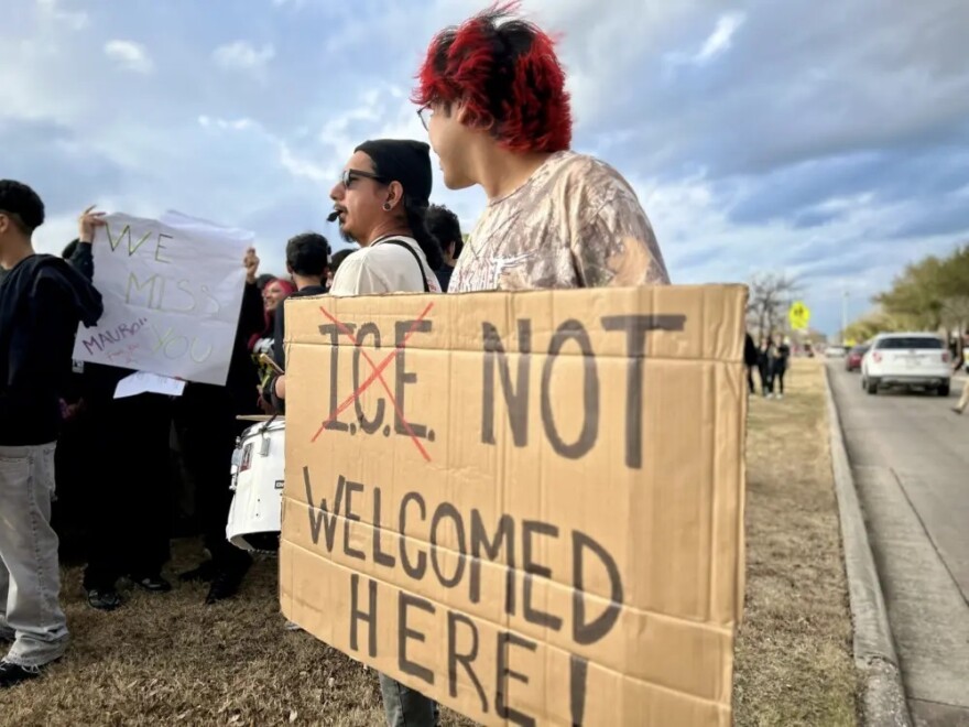 A student holds up a sign during a walkout at Sam Houston Math, Science, and Technology Center on Feb. 3, 2026.