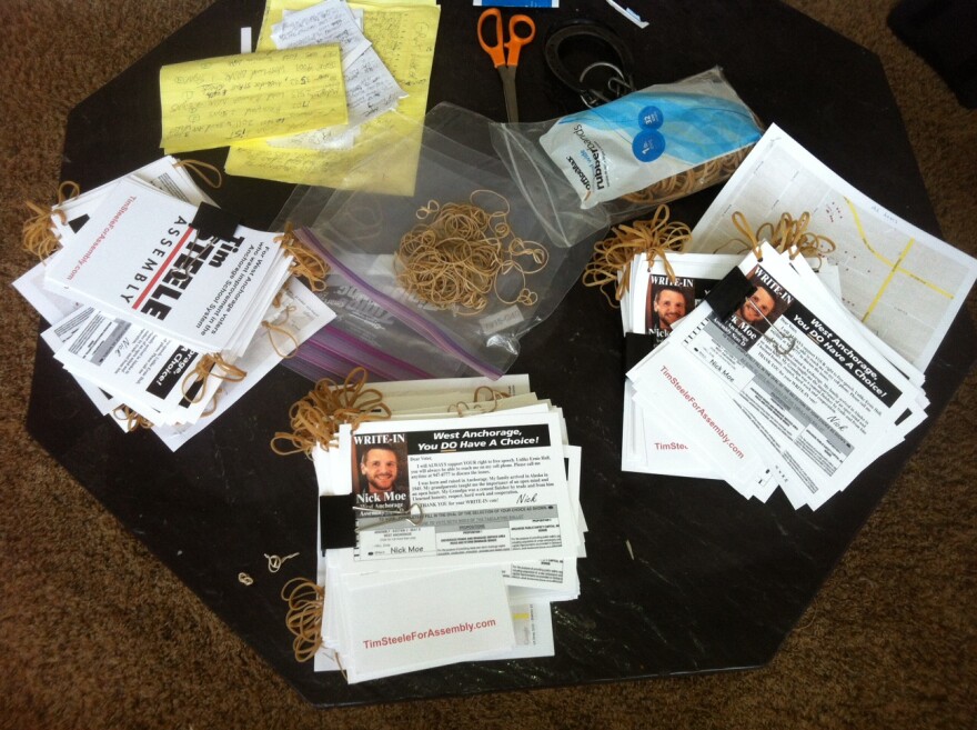 A coffee table at Nick Moe's West Anchorage home serves as headquarters for his campaign.
