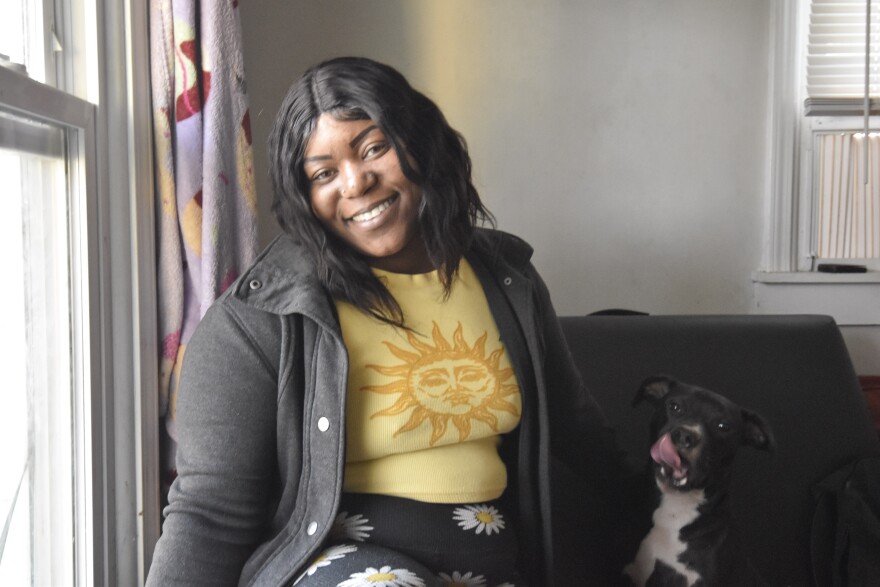 Shirlesha Lindsey and her dog, Poppy, sit inside their home on Alma Court on Nov. 17, 2022. "We might just have to go to hotel for two months," the single mother of three said. "Because it's hard to find a place in the timeframe that they're trying to give us."