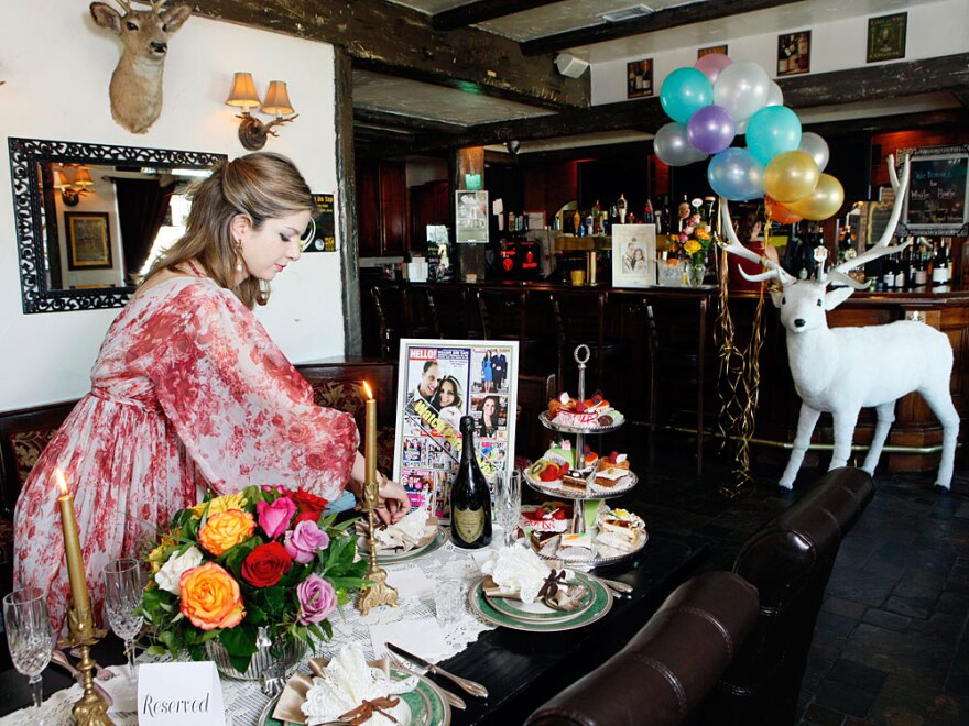 Golriz Moeini decorates her White Harte Pub with items she plans to use for a royal wedding watch party in Woodland Hills, Calif.