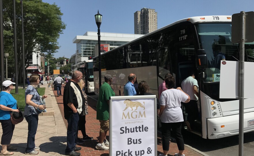 An MGM Springfield shuttle bus loads passengers in downtown Springfield, Massachusetts.