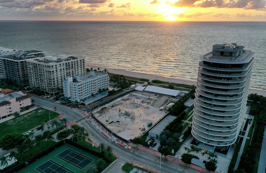 In an aerial view, a cleared lot where the 12-story Champlain Towers South condo building once stood is seen on June 22, 2022 in Surfside, Fla. It had been a year since the tragic event where 98 people died when the building partially collapsed on June 24, 2021.