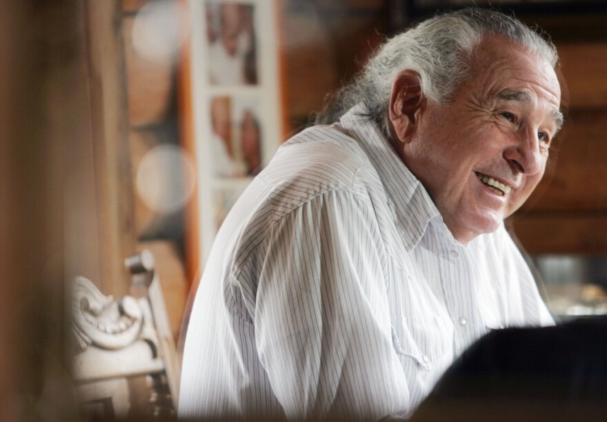 U.S. Sen. Ben Nighthorse Campbell in a white stripped shirt.