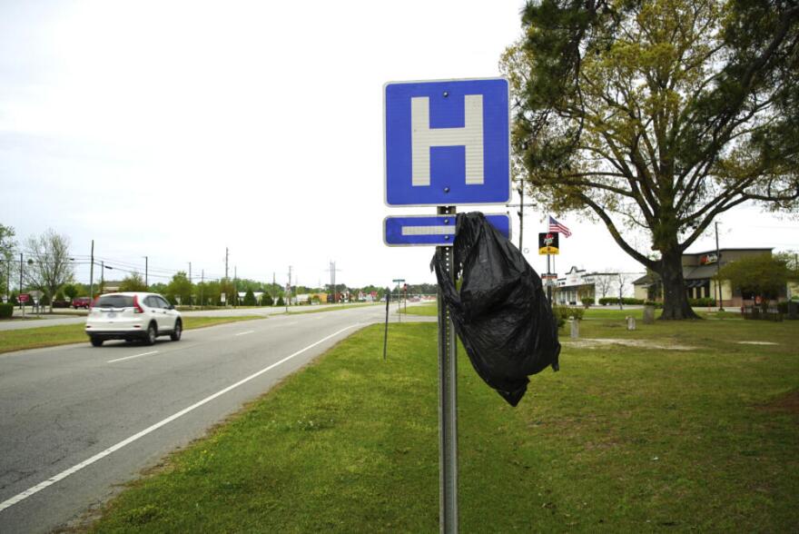 A garbage bag hangs from a hospital sign along U.S. 17 in Williamston, N.C., on Thursday, April 11, 2024. (Allen G. Breed/AP)
