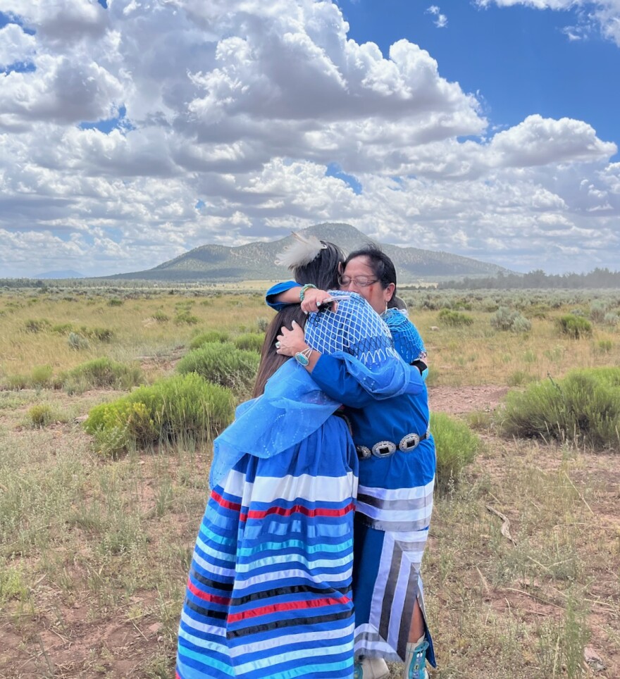 Havasupai Tribe member and Grand Canyon Tribal Coalition Coordinator Carletta Tilousi hugs her daughter, Maya Tilousi-Lyttle, following President Joe Biden's declaration of the Baaj Nwaavjo I’tah Kukveni Grand Canyon National Monument on Tue, Aug. 8, 2023. Tilousi-Lyttle, a youth leader from the Hopi and Havasupai tribes, introduced the president before his remarks at the event.