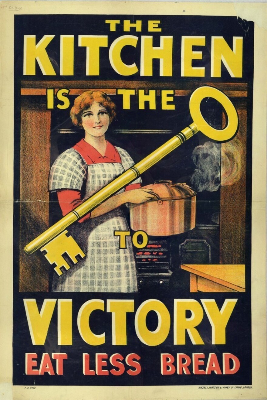 A British propaganda poster from World War I reminds consumers that "The Kitchen is the Key to Victory. Eat Less Bread."