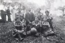 Members of Fort Shaw Indian School Girls Basketball Team (Front- G. Butch, B. Johnson, E. Sansaver; Back- N. Wirth, Mr. McCutcheon, K. Snell, M. Burton)