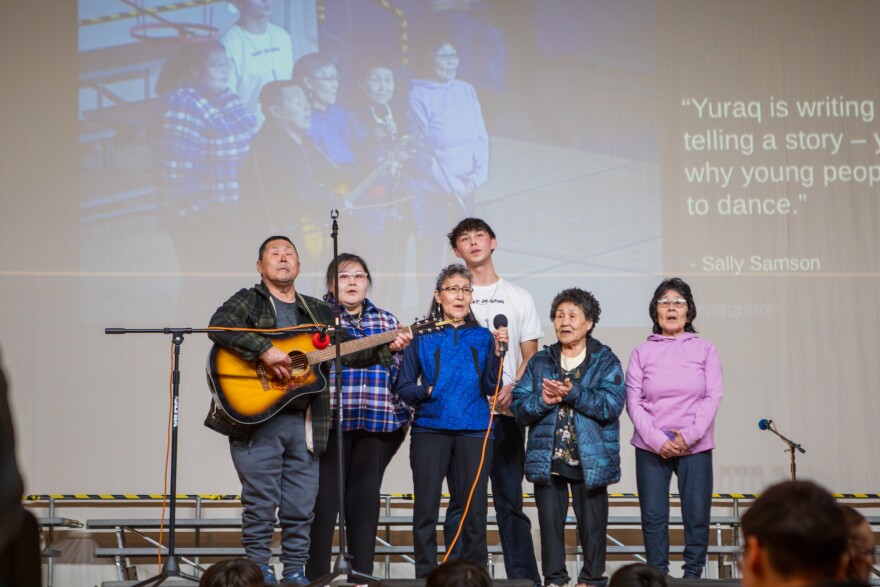 Singer-songwriter Martin Paul of Kipnuk and Kalskag brings his family on stage during his performance at the Cama'i Dance Festival in Bethel, Alaska on March 27, 2026.