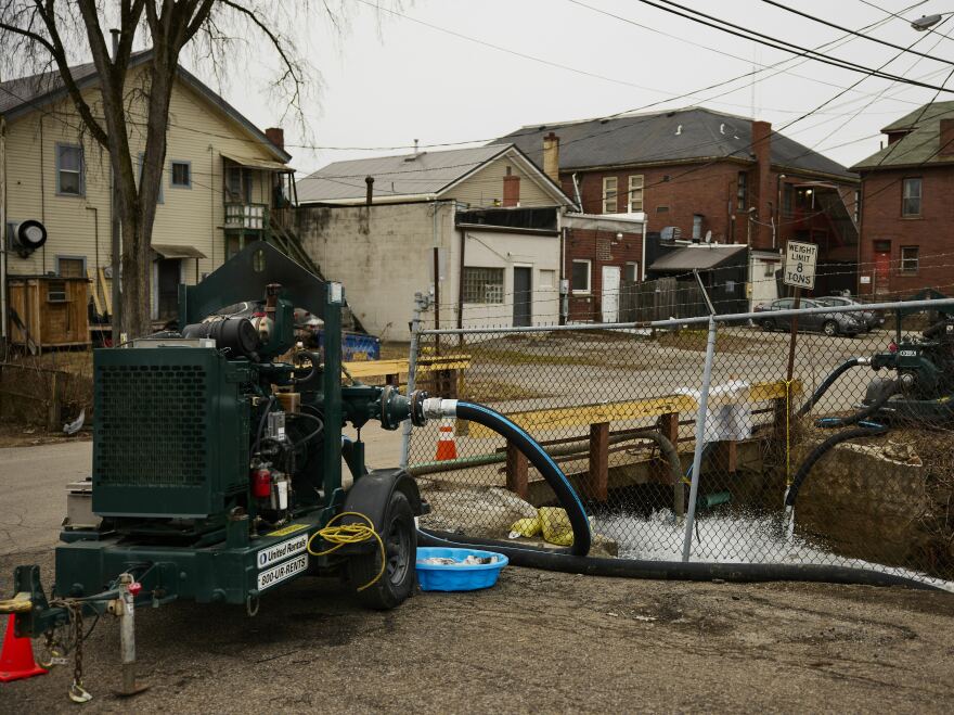 Water is pumped into a creek for aeration on Feb. 14 in East Palestine, Ohio.