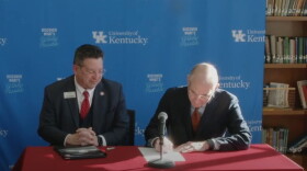 Transylvania University president Brian Lewis and University of Kentucky president Eli Capilouto sign agreement to join "Advancing Kentucky Together" Network