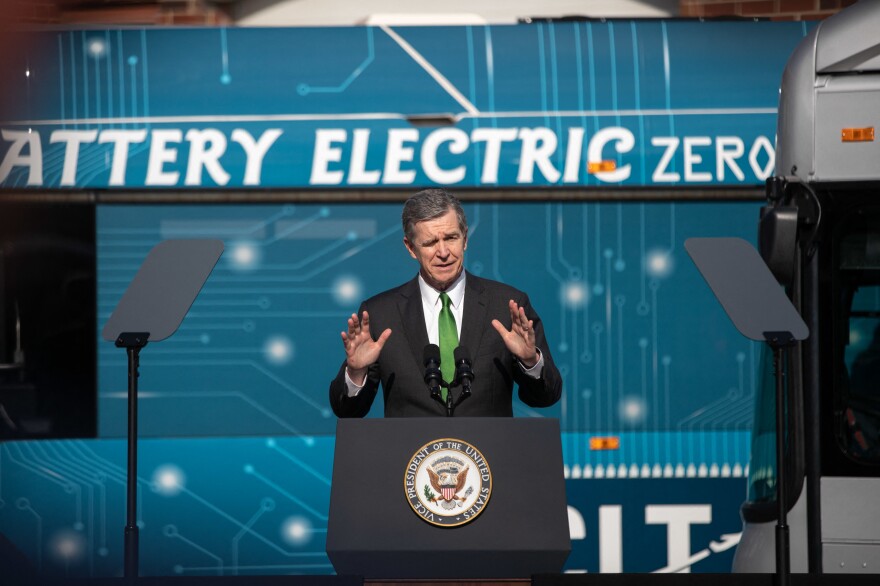 North Carolina Gov. Roy Cooper speaks after touring the electric vehicle operations at Charlotte Area Transit Systems bus garage with Vice President Kamala Harris, on Thursday in Charlotte, N.C.