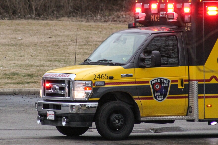 Pike Township Fire Department ambulance with lights flashing. 