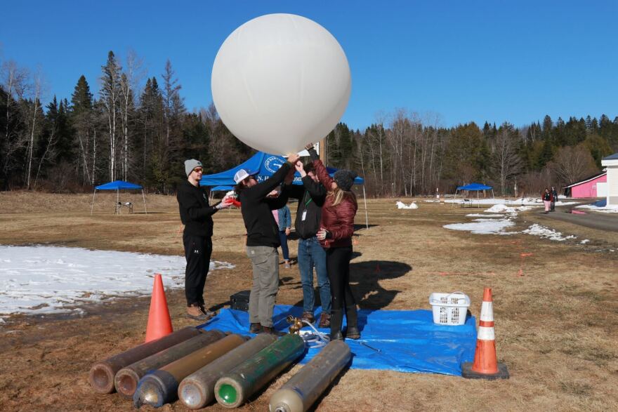 On Sunday, April 7, a team of students and professors from Plymouth State University sent up huge helium balloons carrying science equipment into the sky. The team is one of several dozen across the country working with NASA to study how the eclipse will affect the earth’s atmosphere.