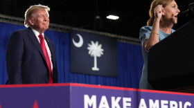 President Donald Trump listens as Sen. Darline Graham, R-S.C., speaks during her campaign rally at the Myrtle Beach Convention Center in Myrtle Beach, S.C., Friday, Aug. 21, 2026.