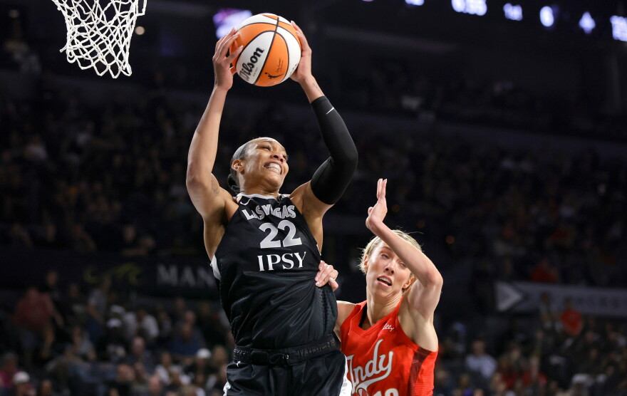 Las Vegas Aces center A'ja Wilson (22) pulls down a rebound by Indiana Fever guard Lexie Hull (10) during the first half in Game 3 of an WNBA basketball first-round playoff series Thursday, Oct.1, 2026, in Las Vegas. (AP Photo/Steve Marcus)