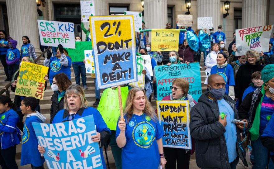 Paraprofessionals rally on the steps of Springfield City Hall to deliver their petition for a fair raise and contract to the Springfield School Committee on March 17, 2022.