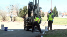 Workers at Creek Run Environmental take a soil sample at a gas station site being cleaned up in Columbus. Creek Run is not involved in the current lawsuit.