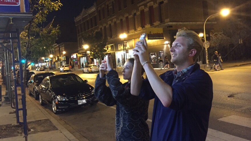 Louise Price and Stanley Opalka, two of the many people taking pictures of the world's first boozy Taco Bell.