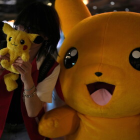 A fan poses for a photograph during Pokemon Day, as they celebrate the 30th anniversary of Pokemon, in London, Friday, Feb. 27, 2026.