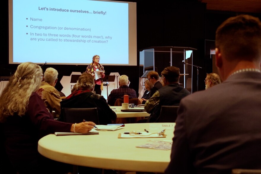 Madi Hirschland speaks to gathered faith leaders about climate action.