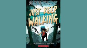 Cover of "Just Keep Walking" by Erin Soderberg Downing; illustration of a hiker with a big backpack and walking stick climbing over rocks and through trees with a wide wilderness landscape behind