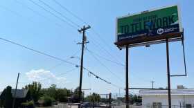 A photo of a tall billboard. 