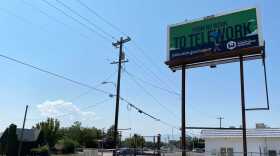 A photo of a tall billboard. 