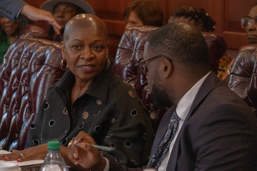 Darlene Dunmeyer-Roberson (left) and her attorney, state Rep. Kambrell Garvin (right) speak at a September hearing in a conference room on the Statehouse grounds. Dunmeyer-Roberson will ultimately stay on the Charleston County School District board. Her term expires in 2028.
