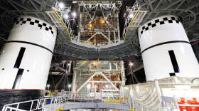 In this photo provided by NASA, the final left and right forward solid rocket booster motor segments for Artemis III are integrated onto the mobile launcher for the SLS (Space Launch System) rocket on Thursday, Sept. 24, 2026 at NASA's Kennedy Space Center in Florida. (Frank Michaux/NASA via AP)