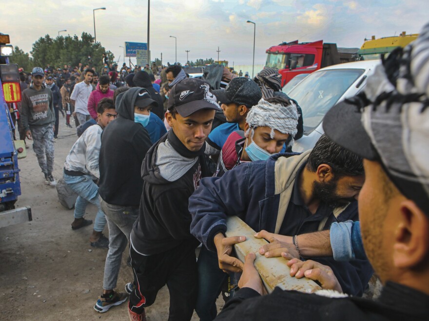 Protesters block a road leading to an oil complex during anti-government protests in Basra in December.