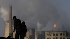 Miners shovel coal at mine in Xiahuayuan county in north China's Hebei province, Friday, Nov. 30, 2007. (Oded Balilty/AP)