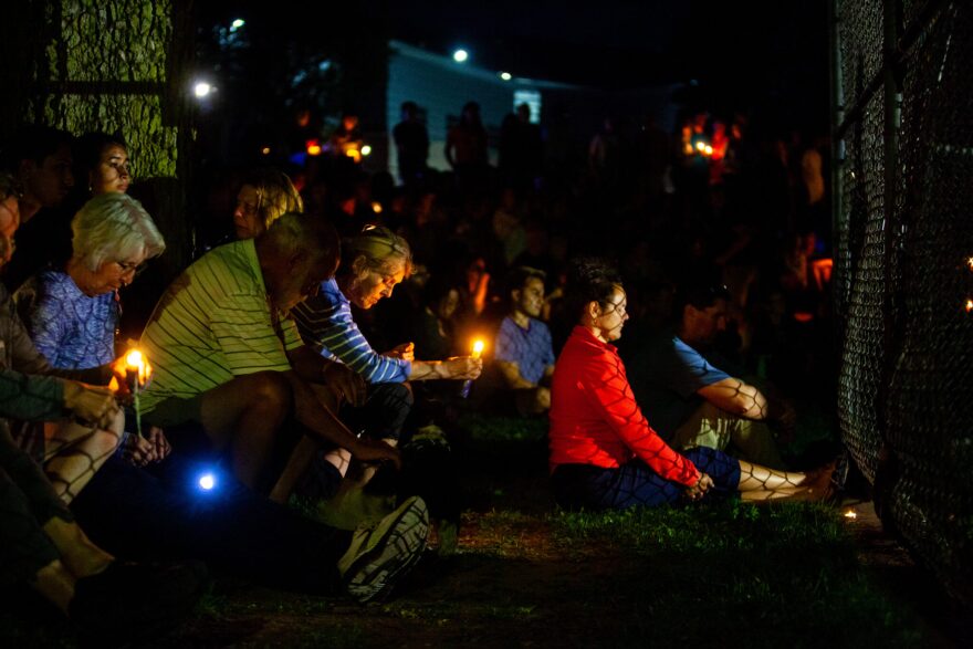 Hundreds gather during a dark and solemn vigil at Lynnhurst Park for the two children who were killed and the several children and parishioners injured in a shooting at Annunciation Church on Wednesday, Aug. 27, 2025, in south Minneapolis.