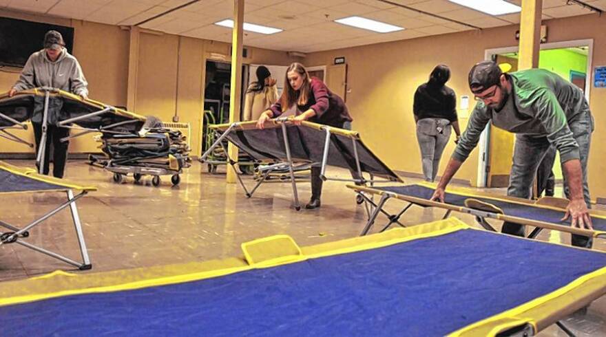 Staff at Craig's Place in Amherst, Massachusetts, practice setting up cots during a training session at the shelter in 2016.