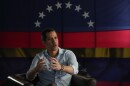 Opposition leader Juan Guaido speaks during an interview with the Associated Press in Caracas, Venezuela, Thursday, Feb. 10, 2022. Guaido said on Tuesday, April 25, 2023, that he is not seeking political asylum in the United States and has not ruled out the possibility of running in a presidential primary planned for October. (AP Photo/Ariana Cubillos, File)
