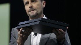 Sony Computer Entertainment President and CEO Andrew House introduces the new PlayStation 4 at an Electronic Entertainment Expo media briefing in Los Angeles on Monday.