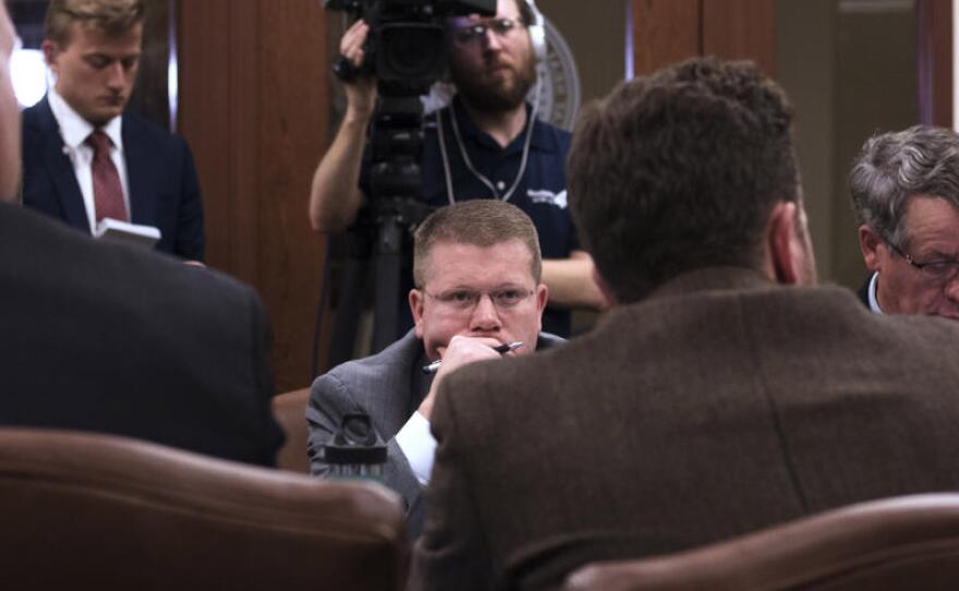  Lawmakers sit in the House Joint Committee on Appropriations and Budget on Tuesday night.