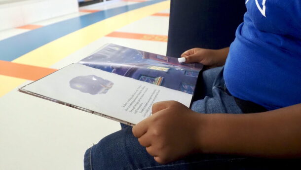 A fifth grader reads a book at Positive Tomorrows school in Oklahoma City on Aug. 17.