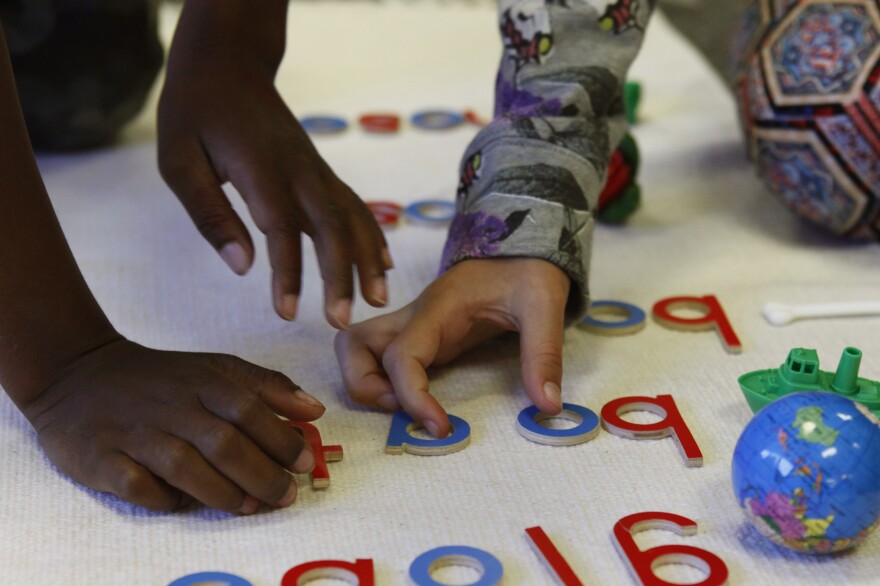 These white floor mats are one hallmark of a Montessori classroom.