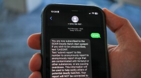 A hand holds a cell phone. On it, a text message reads, "You are now subscribed to the SOAR Deadly Batch Alert system!"