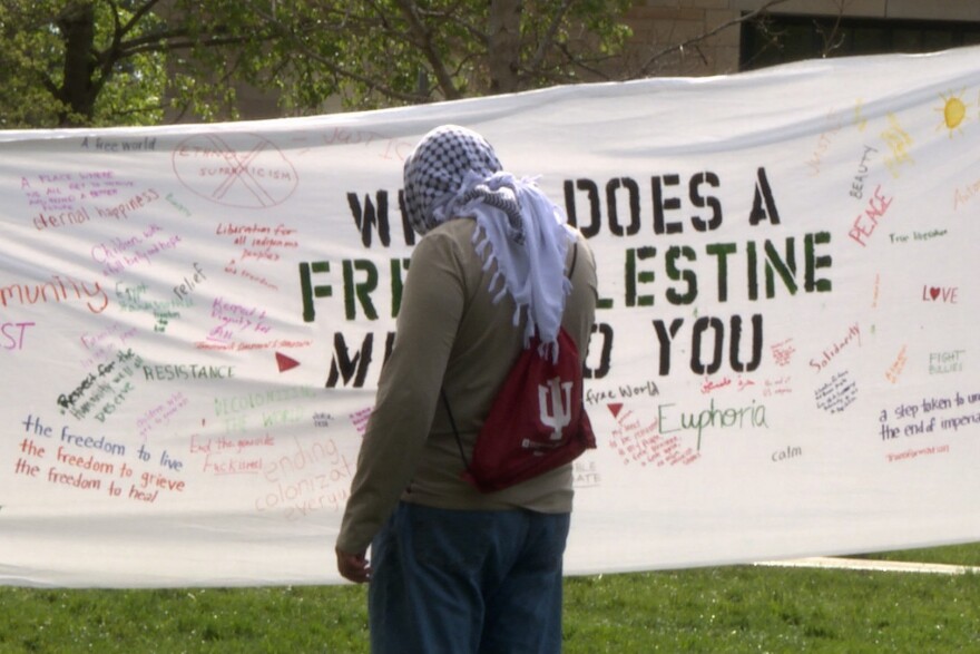 Student with free palestine banner