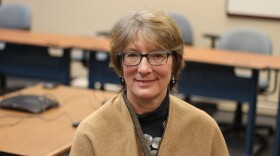 fair haired woman with glasses