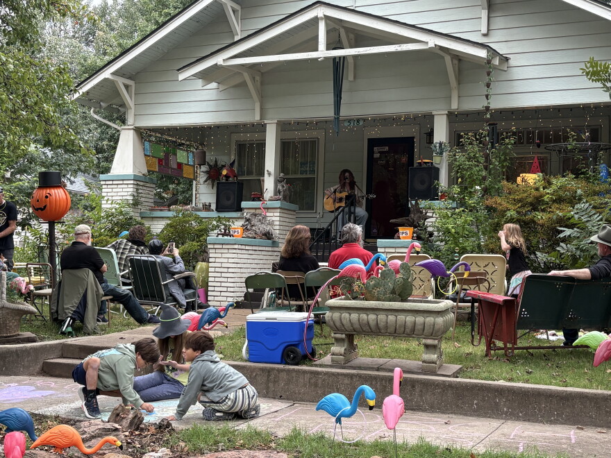 Audience members take in a performance as children play during Norman's annual Porchfest on Saturday, Oct. 3 2026.