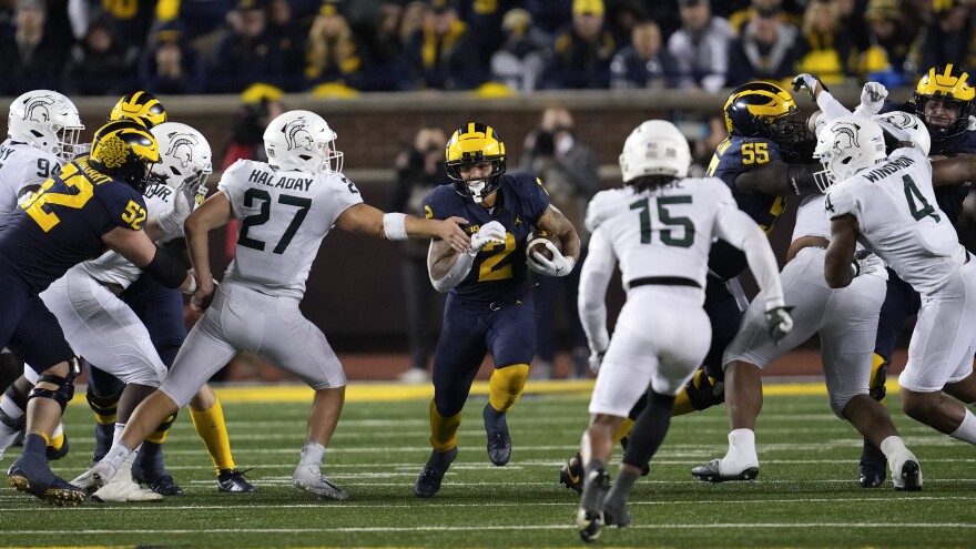 Michigan running back Blake Corum (2) runs against Michigan State in the second half of an NCAA college football game in Ann Arbor, Mich., Saturday, Oct. 29, 2022. (AP Photo/Paul Sancya)