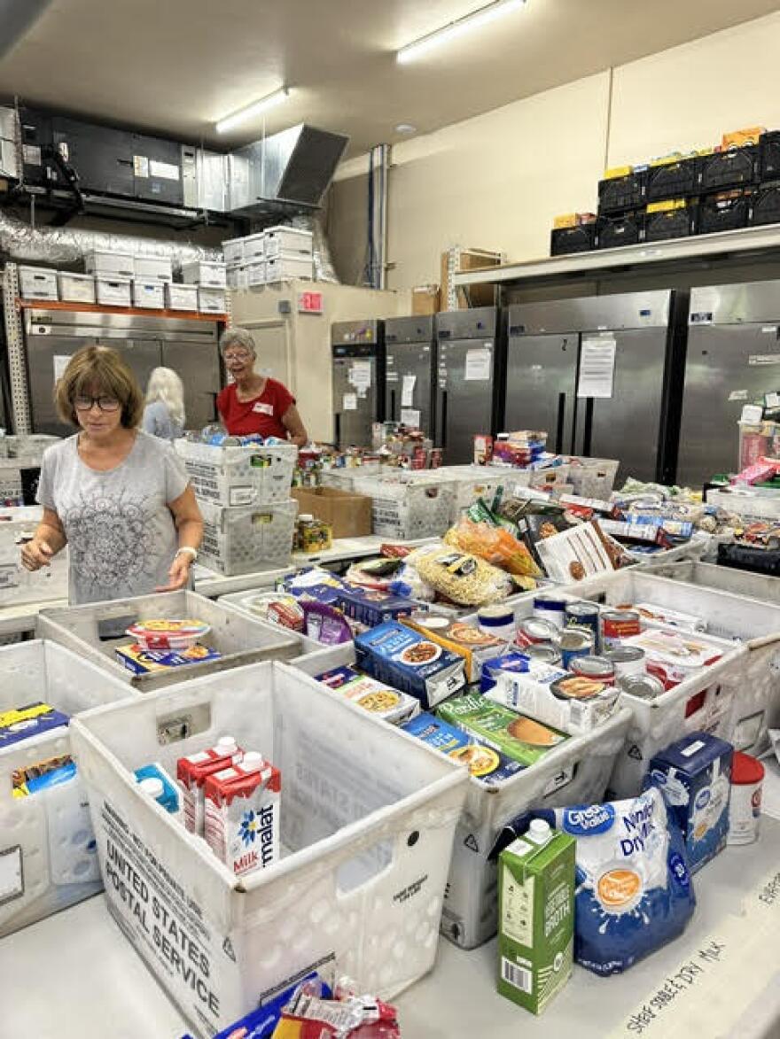 Workers sort food from the recent drive.